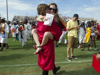 Kristen Linsky congratulates her little brother, Hunter Cureton, after the Vero Beach High School commencement ceremony Saturday at the Citrus Bowl in Vero Beach. This was the largest graduating class to date. (MOLLY BARTELS/TREASURE COAST NEWSPAPERS)
